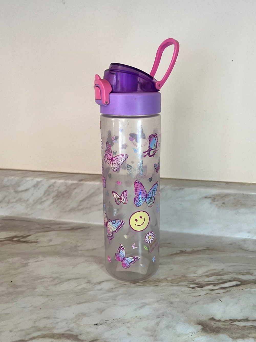 Tall printed water bottle with flip top butterfly and smileys